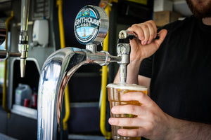 pulling a pint of gower lighthouse lager welsh beer