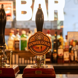 Vintage-style Gower Brewery metal pump clip with Gower Gold design.
